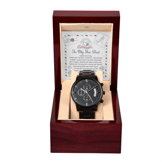 A black chronograph watch with a copper dial is displayed in an open dark red wooden box, with a sentimental message to "To Fur Dad, Unconditional Love - Metal Chronograph Watch" in the background.