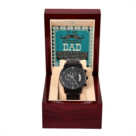 A stylish black chronograph watch, featuring a copper dial, sits elegantly in a wooden box with a sign that reads, "To Boyfriend's Dad, Father Like You - Metal Chronograph Watch.
