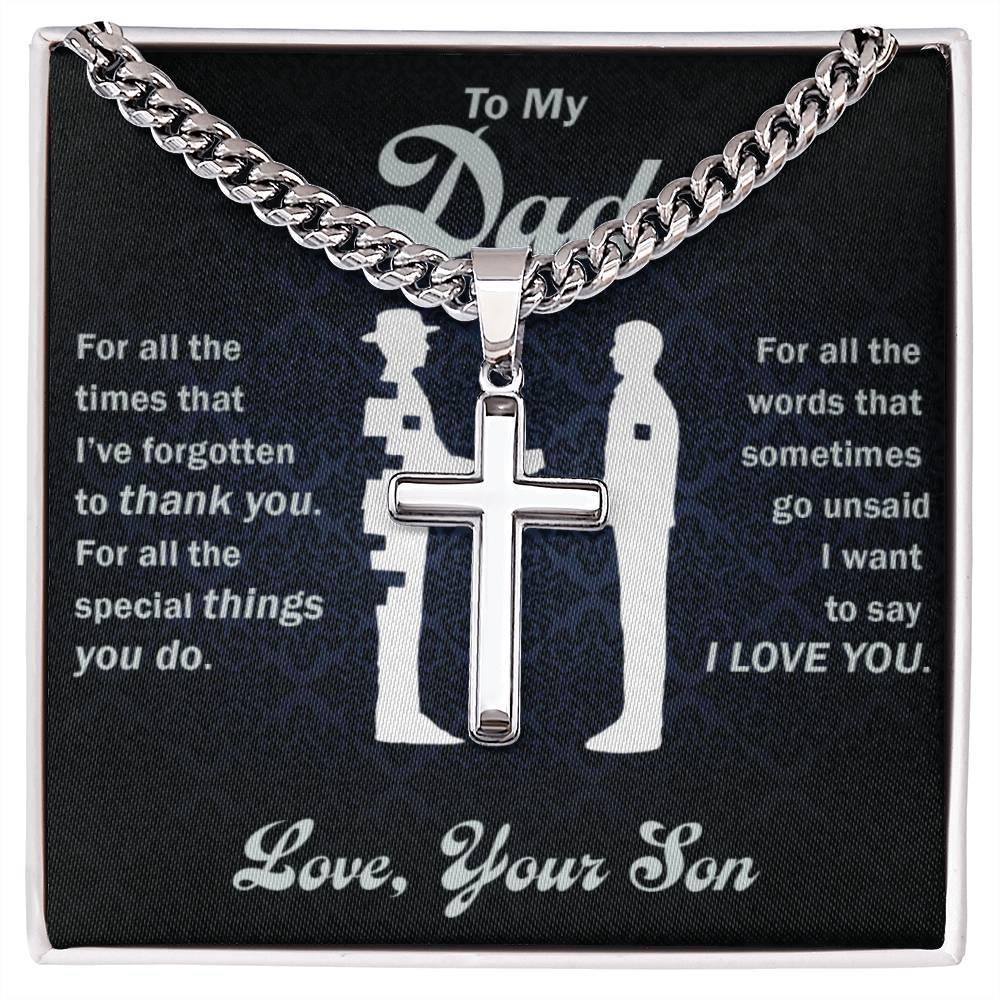 A pendant with a To My Dad, Thank You For Everything - Cross on Cuban Link Chain from ShineOn Fulfillment, placed over a printed fabric with a heartfelt message from a son to his father.