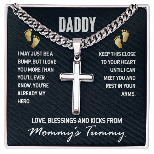 A ShineOn Fulfillment hypoallergenic jewelry piece featuring a Daddy-Just a Bump - Cross on Cuban Link Chain pendant, attached to a message card for an expectant father, expressing love from the unborn child.