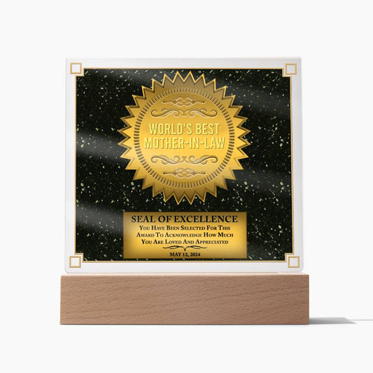 Award plaque titled "Unique Gift For Mother In Law Seal Of Excellence Acrylic Plaque With LED Thank You Gift To My Mother-In-Law For Best Mom In Law Mothers Day" on a black starry background, featuring a gold seal and LED light, with a wooden base. Date and affirmation text included.