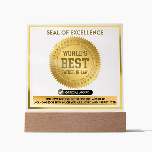 A **To Father-In-Law, Seal Of Excellence - Acrylic Square Plaque** with a gold seal that reads, "World's Best Father-In-Law." Text below says, "You have been selected for this award to acknowledge how much you are loved and appreciated." This unique sentimental gift includes an LED wooden base to showcase its brilliance.