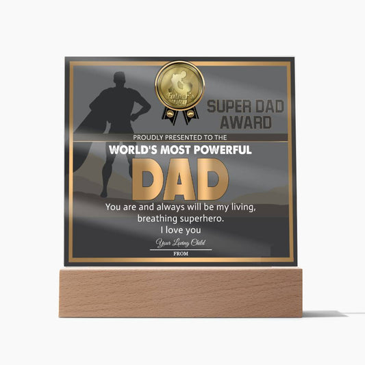 A To Dad, Super Dad Award - Acrylic Square Plaque titled "Super Dad Award" with a shadow figure in a cape, presented to the "World's Most Powerful Dad." Featuring a gold medal icon at the top and a heartfelt message from "Your Loving Child," it rests on an LED wooden base, making it a unique and sentimental gift.