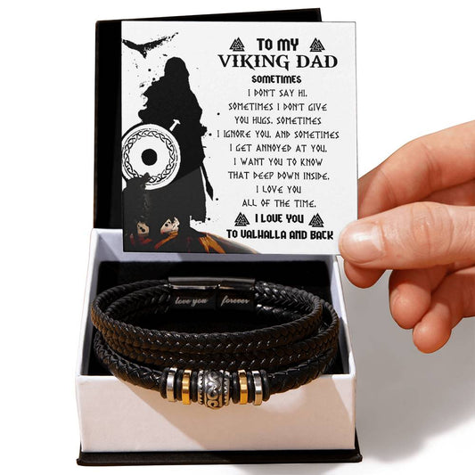 A hand holding a card reading "To My Viking Dad" above a box containing the To Dad, Deep Down Inside - Love You Forever Bracelet.