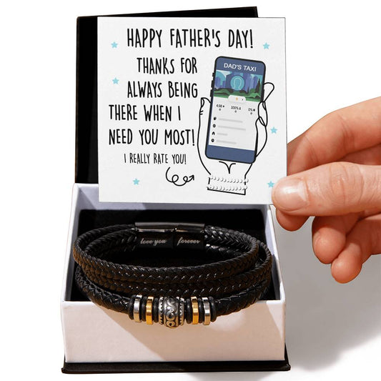 A Father's Day card and a black braided men's bracelet crafted from vegan leather in a gift box. The card reads, 'Happy Father's Day! Thanks for always being there when I need you most! I really rate you!'. Product Name: To Dad, Dad's Taxi - Love You Forever Bracelet.