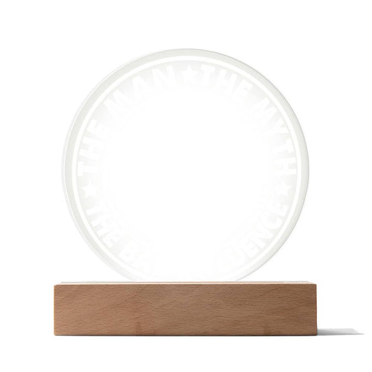 A premium acrylic circular plaque with the text "THE MAN * THE MYTH * THE BAD INFLUENCE" etched around the edge, elegantly mounted on a rectangular wooden LED base, called "To Dad, The Man - Acrylic Circle Plaque".