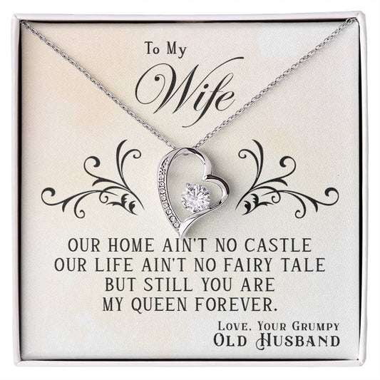 A "To My Wife, You Are My Queen Forever - Forever Love" necklace with a heart pendant, displayed with a message to a wife from her husband, expressing endearment with a playful acknowledgment of imperfection from ShineOn Fulfillment.