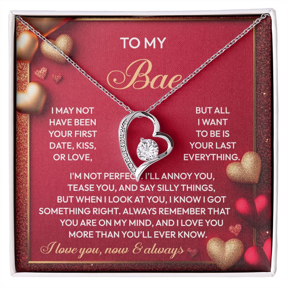 The Soulmate-On My Mind - Forever Love Necklace showcases a silver heart pendant adorned with a sparkling CZ crystal. It rests on a romantic card embellished with heartfelt text and intricate heart designs, offering timeless elegance and charm.