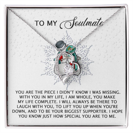 The Soulmate-Laugh With You - Forever Love Necklace features two interlocking hearts in silver with colorful accents, enhanced by a gold finish. It is elegantly presented in a gift box embellished with cubic zirconia and carries a heartfelt message about love and support for your soulmate.