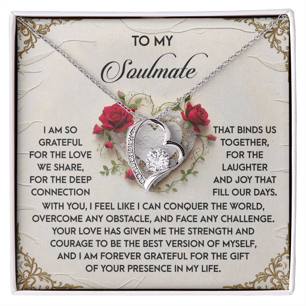 The Soulmate-Our Days - Forever Love Necklace showcases a double heart pendant with CZ crystals, elegantly presented on a card with a heartfelt love and gratitude message, beautifully decorated with red roses. Its white gold finish adds timeless elegance.