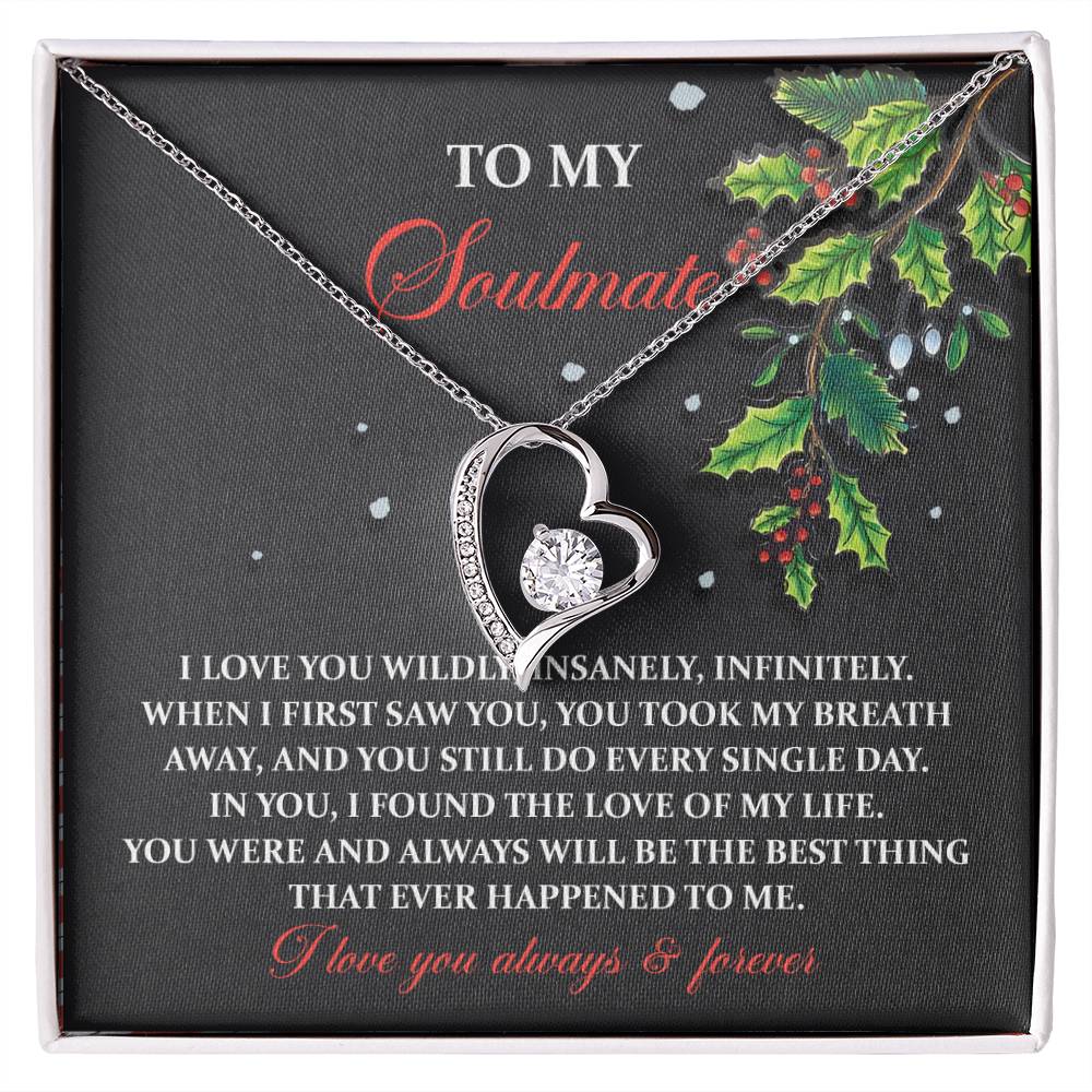 The Soulmate-You Still Do - Forever Love Necklace is a heart-shaped piece available in a choice of white gold or yellow gold finish, featuring a sparkling CZ crystal. It is elegantly presented on a card that carries a romantic message for your soulmate and is beautifully adorned with holly illustrations.