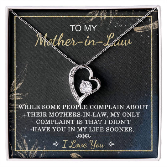 A To Mother-In-Law, In My Life - Forever Love Necklace with a heart-shaped cubic zirconia pendant on a display card, featuring a message expressing love and appreciation to a mother-in-law.