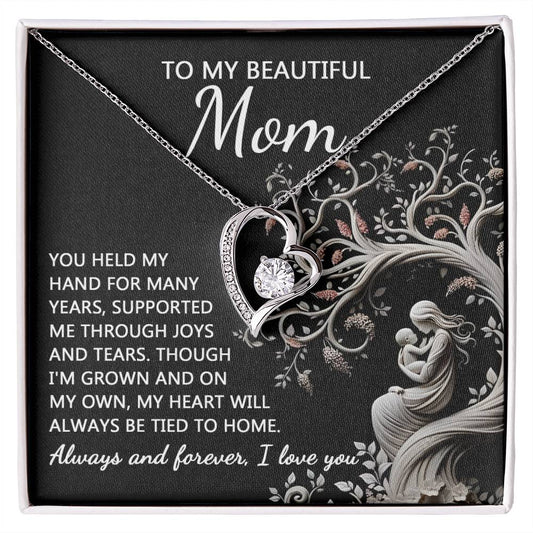 To Mom, On My Own - Forever Love Necklace with a message card, placed on a black background with floral designs.