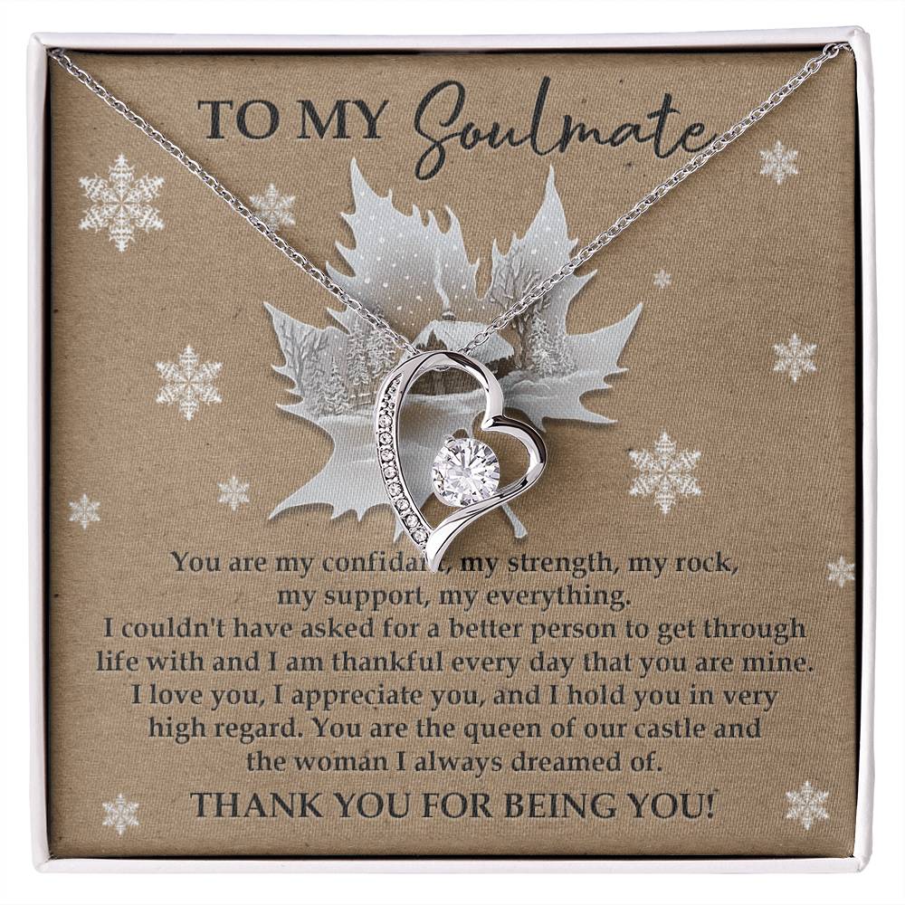 The Soulmate-Our Castle - Forever Love Necklace, showcasing a heart-shaped cubic zirconia stone, is beautifully presented on a card featuring a heartfelt message to your soulmate, accented by delicate snowflake designs and highlighted with its luminous white gold finish.