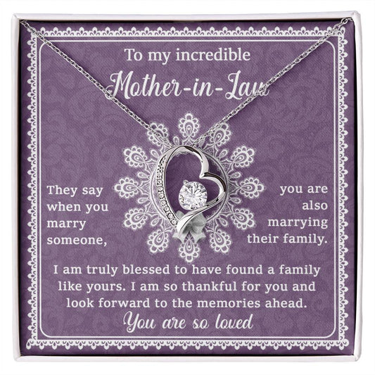 A gift box with a personalized jewelry piece, the "To Mother-In-Law, Family Like Yours - Forever Love Necklace," a pendant shaped like a heart and an engraved message on a purple background, dedicated to a mother-in-law.