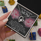 A hand holds an open jewelry box containing the "To Bonus Mom, My Chosen Mom - Forever Love Necklace," accompanied by a message card that reads "To My Chosen Mom." The background features small wrapped gift boxes, making it an ideal Mother's Day gift.