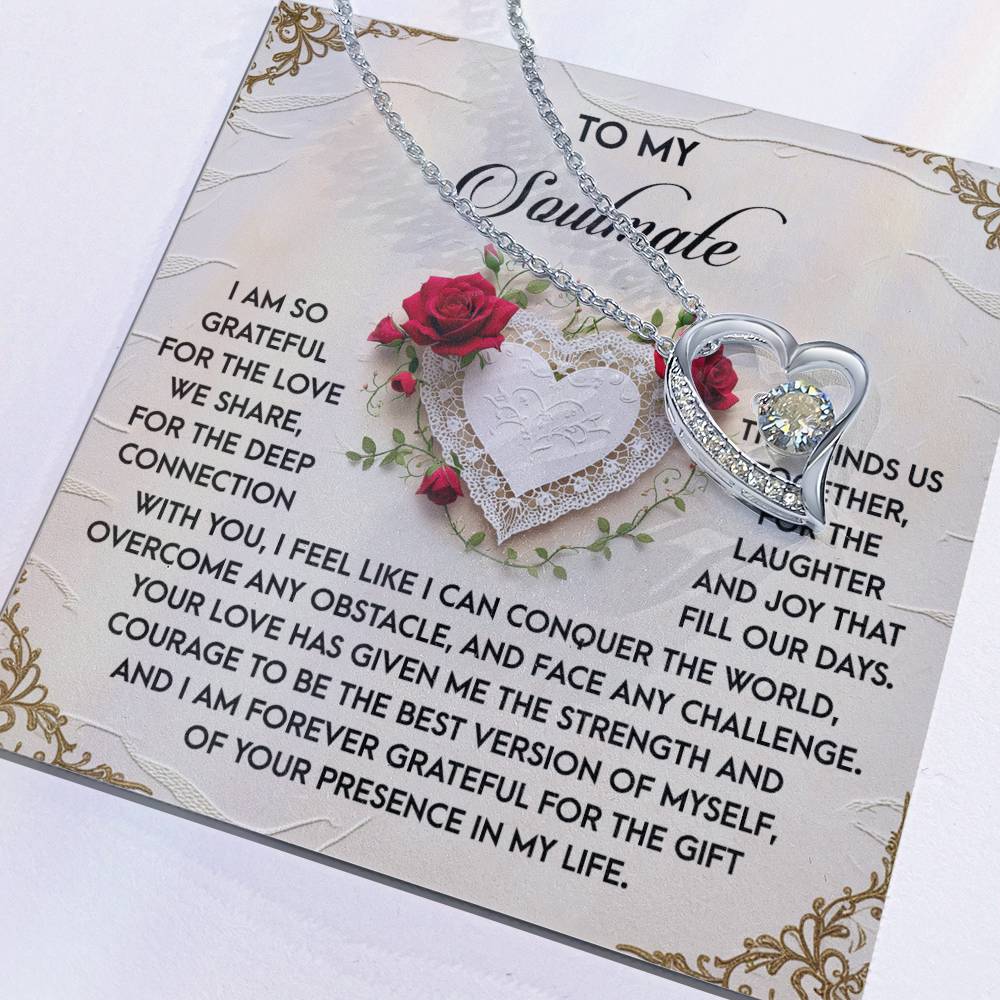 The Soulmate-Our Days - Forever Love Necklace features a heart-shaped pendant with a "To My Soulmate" message card, adorned with CZ crystal accents and roses on a white gold finish, symbolizing timeless affection with gratitude and love.