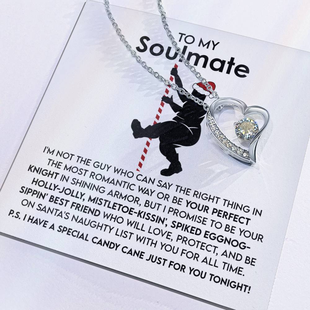 The Soulmate-For All Time - Forever Love Necklace, crafted in 14k white gold, showcases a heart-shaped pendant adorned with a shimmering cubic zirconia stone. It is presented on a special card that reads "To My Soulmate," beautifully highlighting a silhouetted figure holding a candy cane.