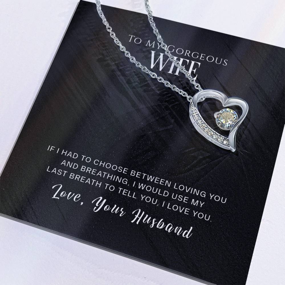 A sentimental gift featuring a ShineOn Fulfillment's To My Wife, I Love You - Forever Love Necklace, a heart-shaped pendant necklace with a love note from a husband to his wife.