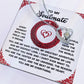 The Soulmate-Like A Dream - Forever Love Necklace is a silver heart-shaped piece with a sparkling cubic zirconia stone finished in white gold. It rests on a card with a romantic message for your soulmate, framed by red designs and featuring an elegant red heart motif.