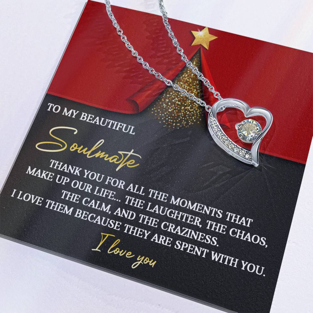 The Soulmate-The Moments - Forever Love Necklace boasts a heart-shaped pendant embellished with shining cubic zirconia, crafted in an exquisite gold finish. It is presented on a decorative card that eloquently expresses love and gratitude to your soulmate.