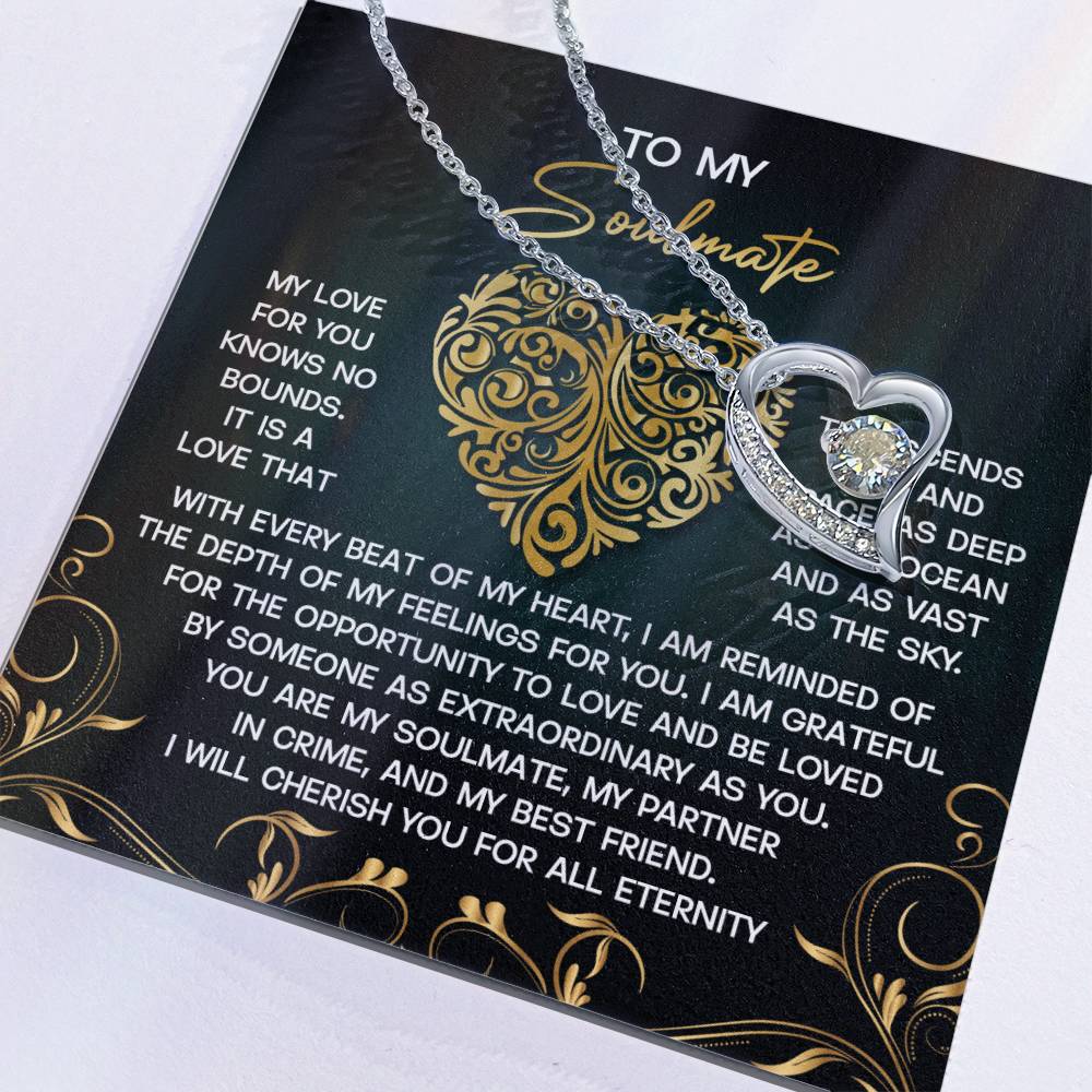The Soulmate-The Sky - Forever Love Necklace includes a silver heart-shaped pendant with a sparkling CZ crystal, set on a card featuring a gold heart design that beautifully expresses love and appreciation for your soulmate.