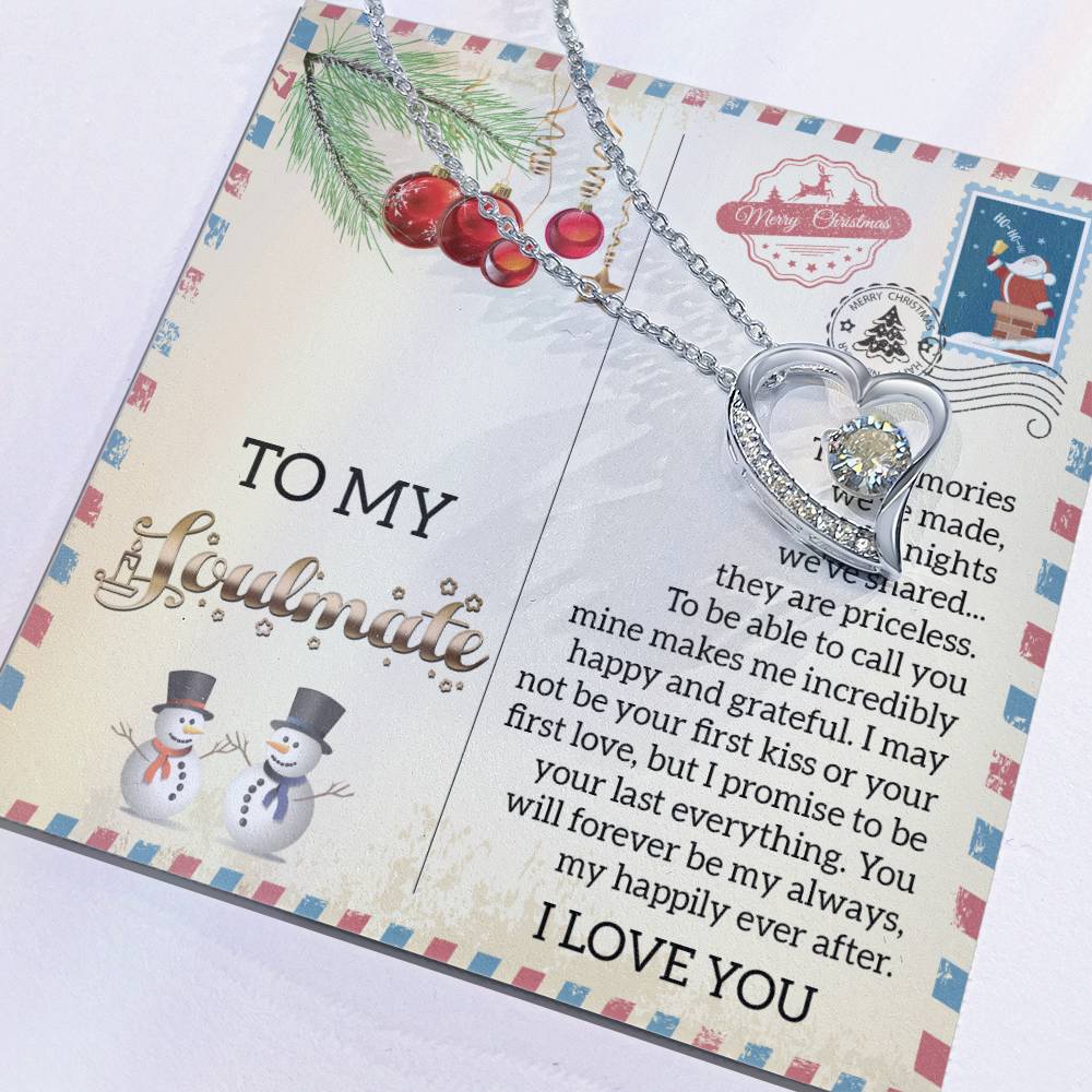 A Christmas-themed card with a snowman motif and heartfelt message, featuring the Soulmate-Last Everything - Forever Love Necklace adorned with a CZ crystal sparkling stone in a stunning gold finish.
