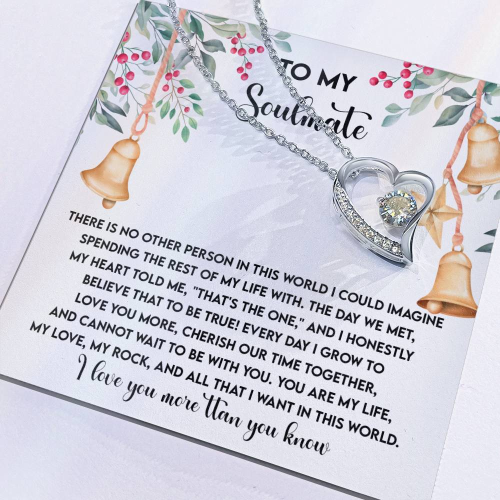 The Soulmate-Be With You - Forever Love Necklace, shaped like a heart and adorned with a cubic zirconia stone, is beautifully presented on a card titled "To My Soulmate," which includes a romantic message and floral designs.