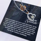The Soulmate-Eternal Happiness - Forever Love Necklace features a CZ crystal on a card with romantic messages and floral designs. Its heart-shaped charm and white gold finish make it an enduring symbol of affection.