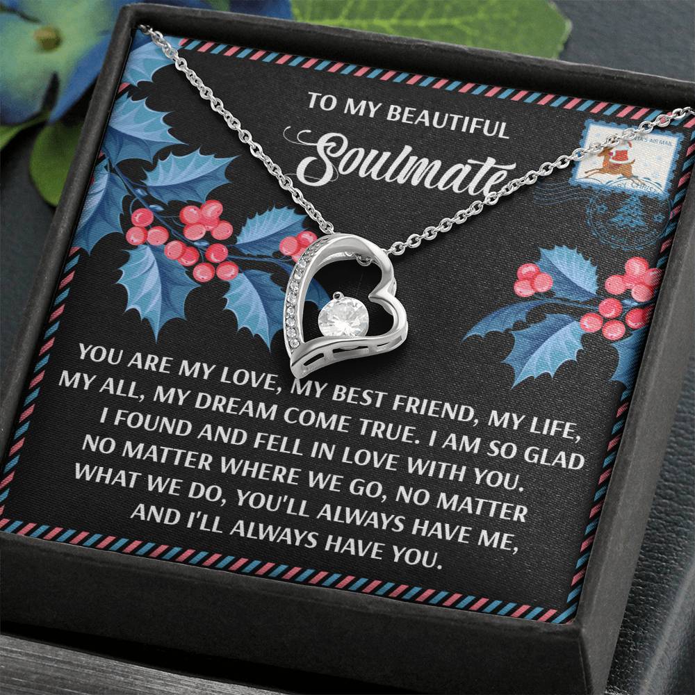 The Soulmate-Fell In Love - Forever Love Necklace showcases a heart-shaped pendant with a gemstone on a floral background, inscribed with "To my beautiful soulmate," conveying eternal love and gratitude.