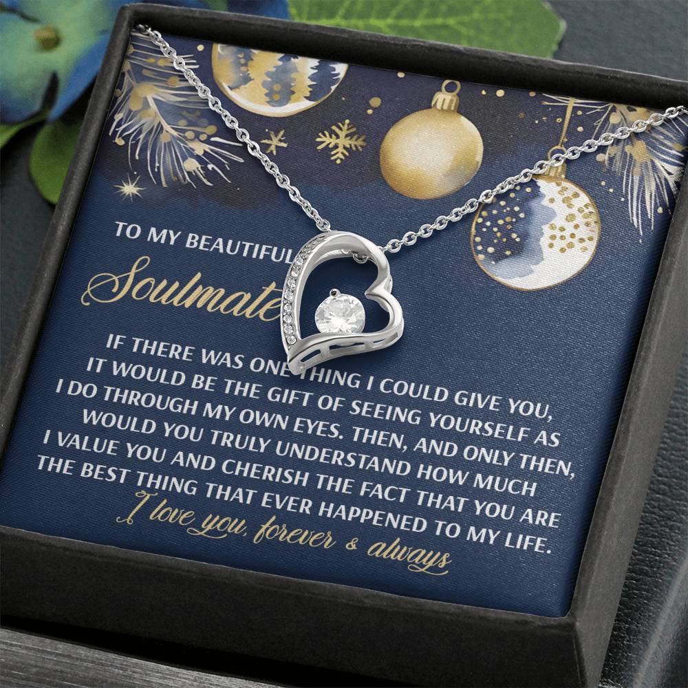 Soulmate-One Thing - Forever Love Necklace, featuring a heart-shaped pendant with CZ crystal and a white gold finish, nestled in a gift box adorned with romantic messages and festive illustrations.