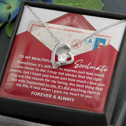 The Soulmate-Right Words - Forever Love Necklace showcases a heart-shaped pendant adorned with a stunning cubic zirconia crystal, beautifully displayed over a romantic message card within a gift box. Its exquisite gold finish imparts a timeless elegance.