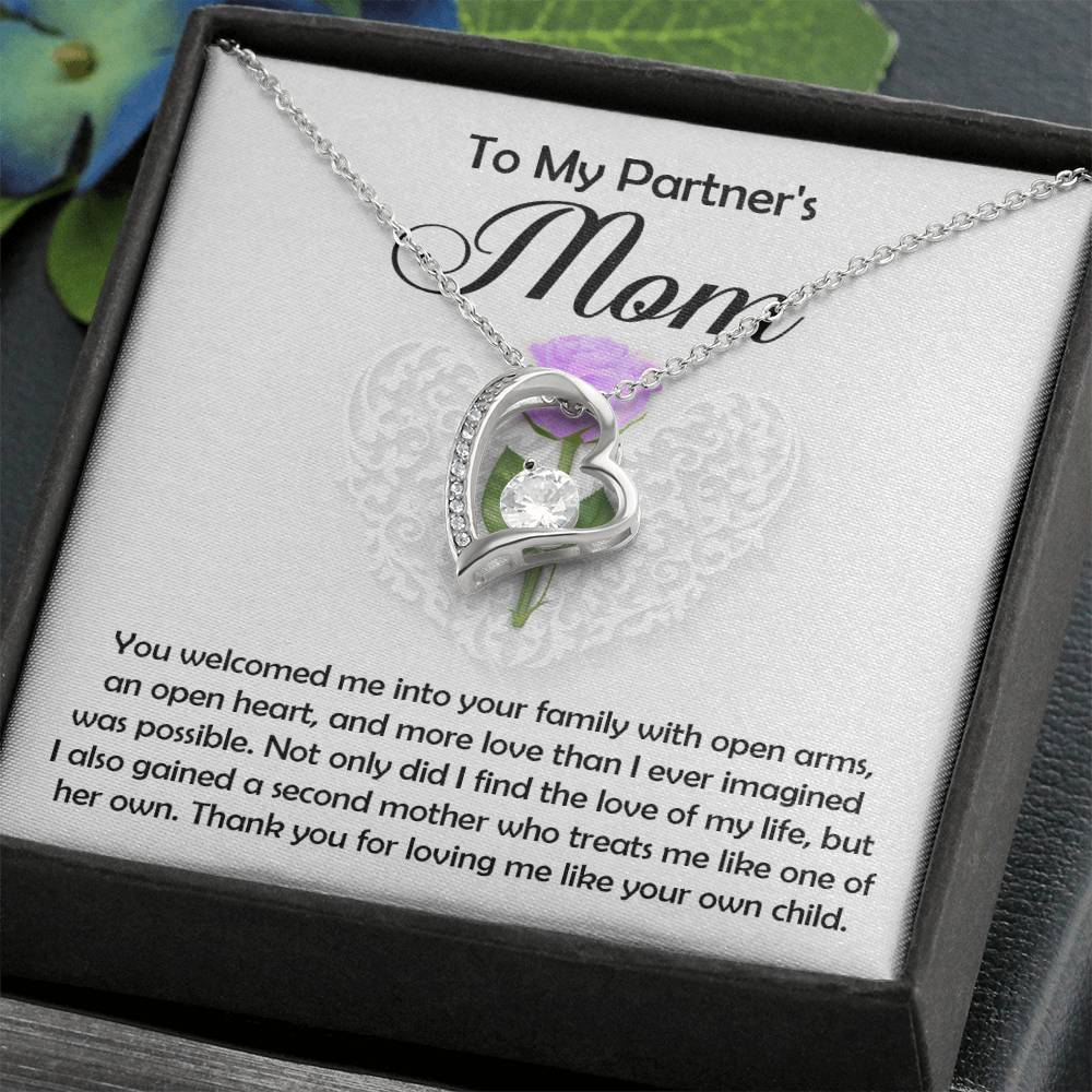 The Partner's Mom-A Second Mother - Forever Love Necklace features a silver heart pendant with a cubic zirconia center, displayed in a gift box with a heartfelt message thanking your partner’s mom for her love, kindness, and acceptance.