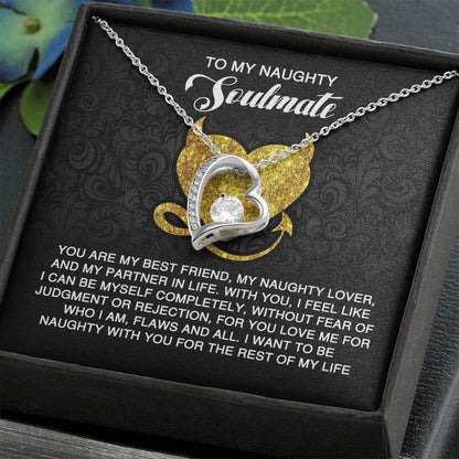 The Soulmate-Naughty With You - Forever Love Necklace boasts a heart-shaped pendant with a sparkling cubic zirconia, elegantly set in gold. Presented on a printed card, it beautifully expresses love, acceptance, and commitment to your special partner.