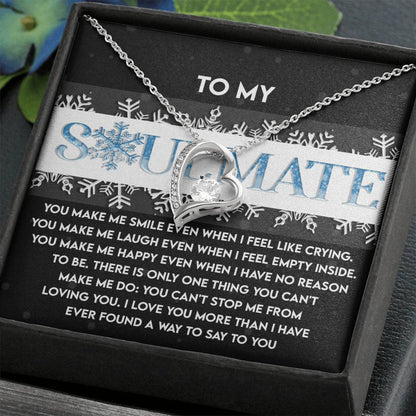 The Soulmate-Loving You - Forever Love Necklace features a heart-shaped pendant with dazzling CZ crystal and is beautifully packaged in a jewelry box. It includes snowflake designs and a message card labeled "To My Soulmate," all elegantly finished in white gold for an exquisite touch of romance.