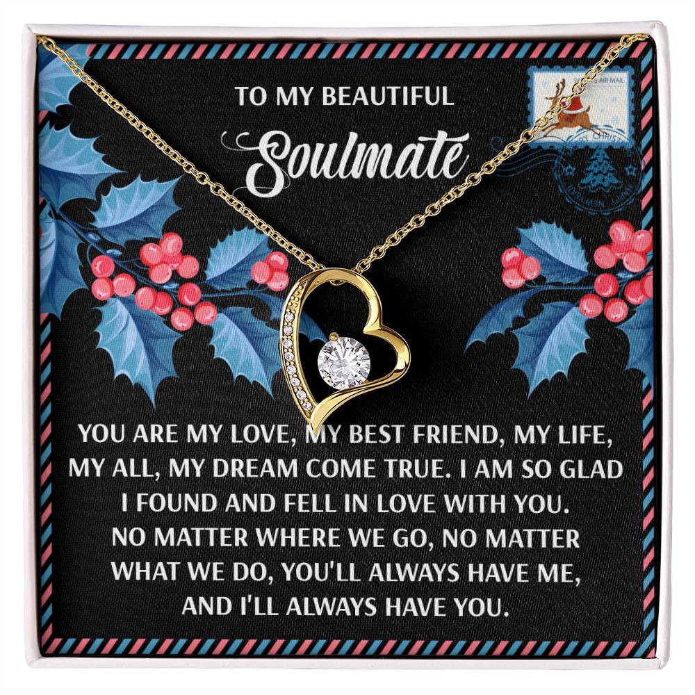 The Soulmate-Fell In Love - Forever Love Necklace features a heart-shaped design with a gemstone on a holiday-themed background. The message reads: "To my beautiful soulmate. You are my love, my best friend, my life, my all, my dream come true.