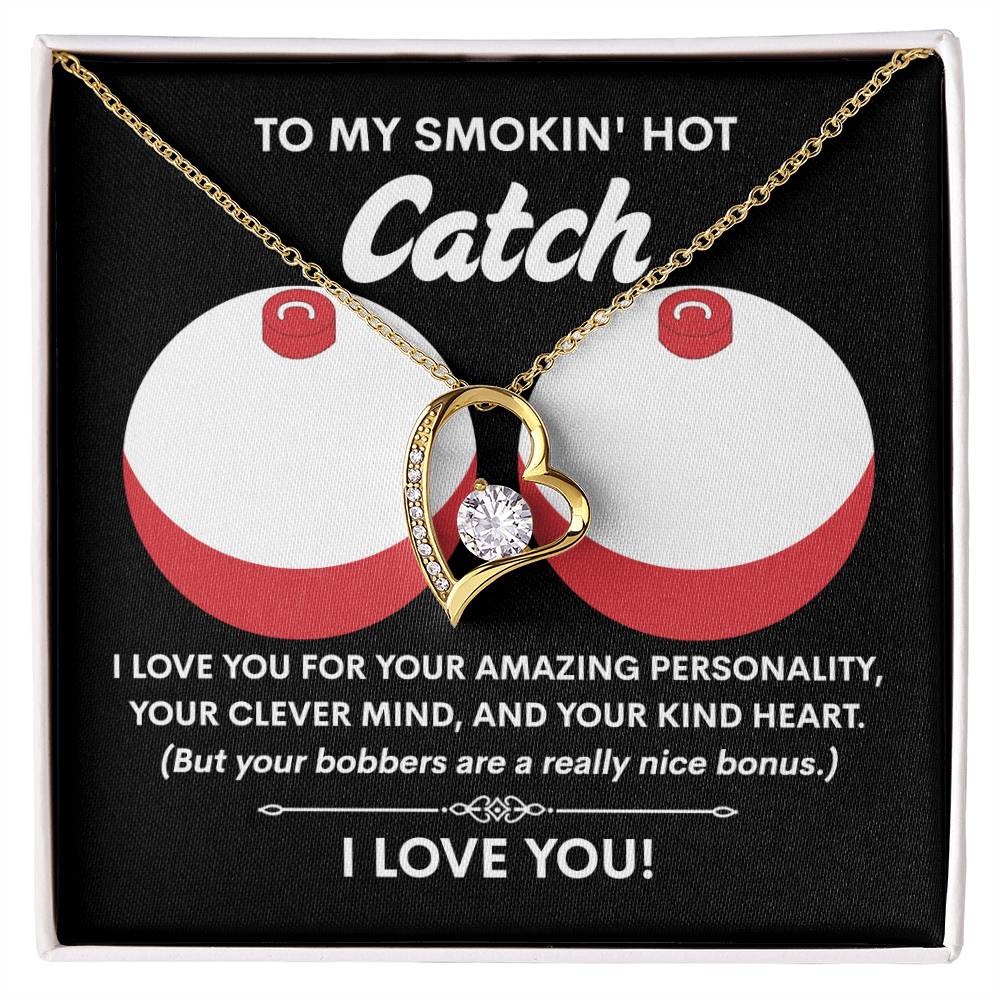 The Soulmate-Nice Bonus - Forever Love Necklace features a heart-shaped pendant with a 6.5mm CZ crystal and white gold finish, presented on a card reading "To my smokin' hot catch" with playful text and fishing bobber graphics.