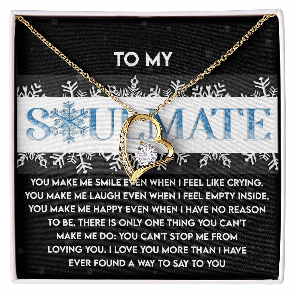 The Soulmate-Loving You - Forever Love Necklace, showcasing a gold heart adorned with a small diamond at its center, is beautifully presented on a black card that reads "To My Soulmate" along with a heartfelt message.