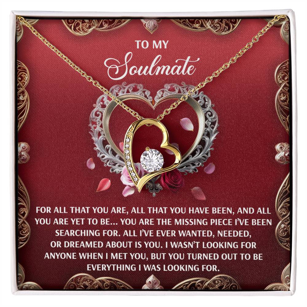 The Soulmate-I Met You - Forever Love Necklace features a heart-shaped pendant with a 6.5mm CZ crystal, displayed on red velvet and accompanied by a heartfelt message for your soulmate.