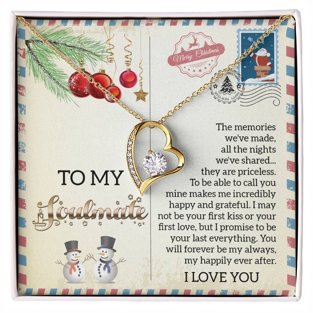 The Soulmate-Last Everything - Forever Love Necklace features a CZ crystal elegantly set in a gold heart, complemented by an insightful note on love and memories. This exquisite necklace is showcased on a festive card adorned with Christmas designs and snowman illustrations, beautifully finished with stunning white gold.