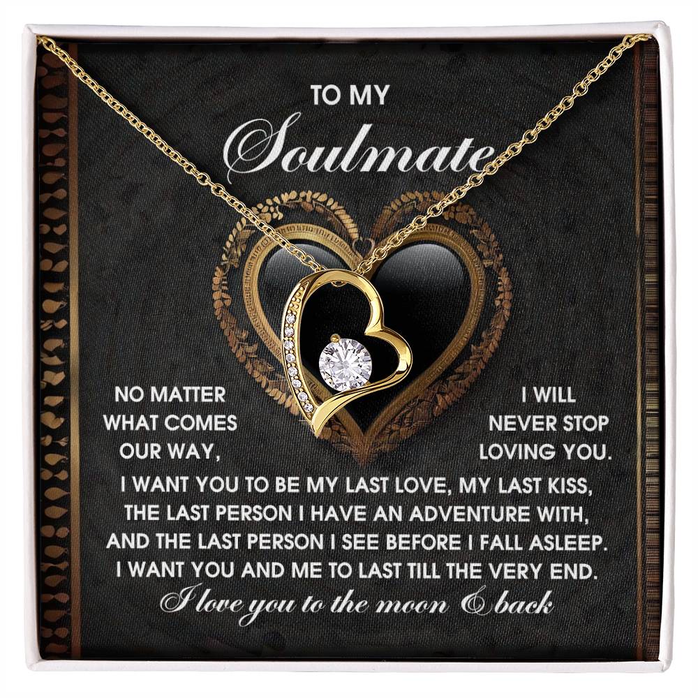 The Soulmate-The Very End Forever Love Necklace features a heart design with a central cubic zirconia stone, shines against a "To My Soulmate" card with a romantic message, and is crafted with a 14k white gold finish, making it an ideal emblem of eternal devotion.