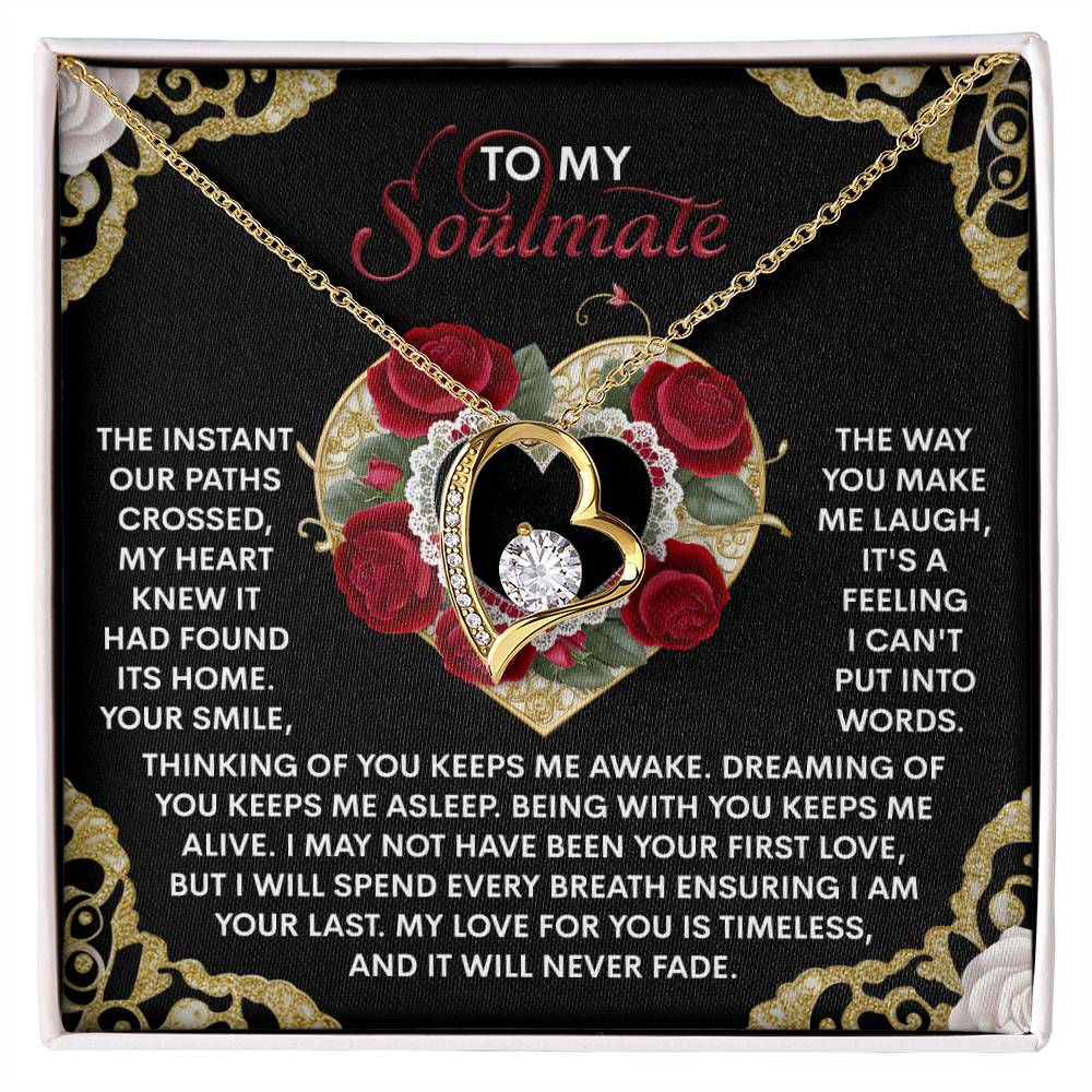 The Soulmate-Never Fade - Forever Love Necklace showcases intertwined hearts on a floral backdrop, crafted with a white gold finish and adorned with CZ crystals, complete with a touching message celebrating love and appreciation for your soulmate.