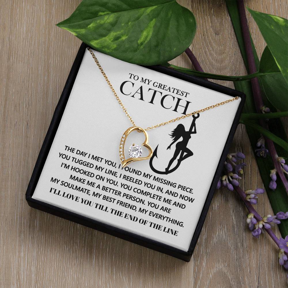 The Soulmate-Hooked On You - Forever Love Necklace showcases a gold heart with a sparkling diamond pendant and an elegant message card that says "To My Greatest Catch." Set in a white gold finish with shimmering cubic zirconia, it makes the perfect romantic gesture.