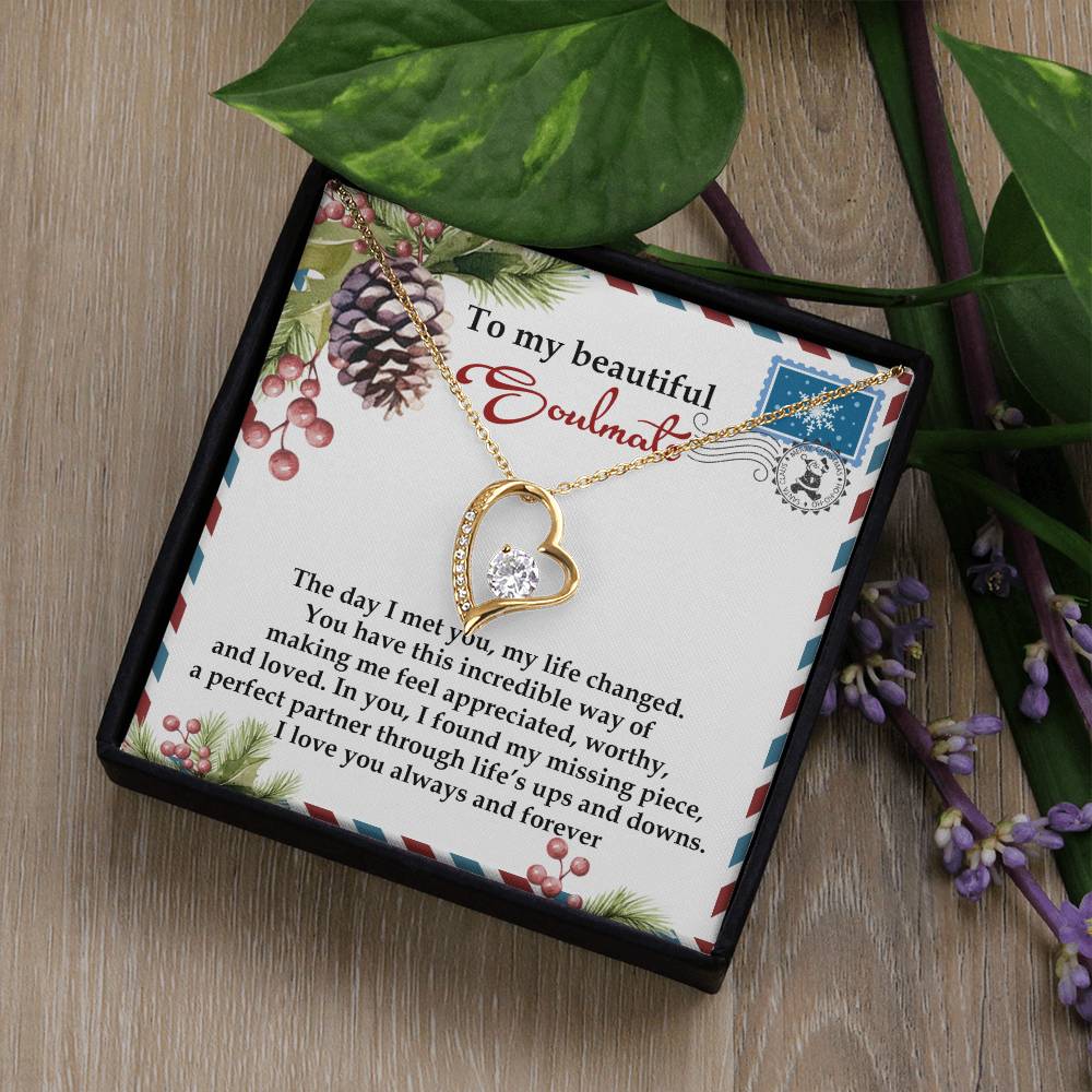 The Soulmate-Perfect Partner - Forever Love Necklace features a gold heart adorned with a dazzling crystal pendant, beautifully presented in a box. A heartfelt message is included on the decorative card inside, making it an ideal gift.