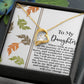 The Daughter-Biggest Fan - Forever Love Necklace showcases a heart-shaped design with a gold finish, adorned by a stunning diamond pendant. It is presented on a card featuring an affectionate message to your daughter, enhanced with elegant leaf designs, and comes in an exquisite gift box.