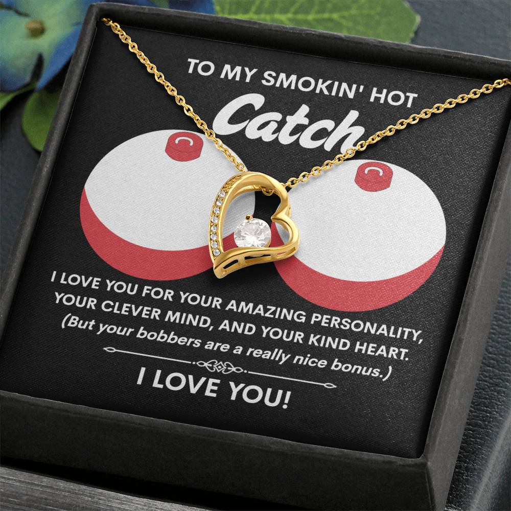 The Soulmate-Nice Bonus - Forever Love Necklace features a heart-shaped design with a 6.5mm CZ crystal, elegantly displayed in a box with humorous love and fishing text. Its white gold finish embodies timeless romance with a playful twist.