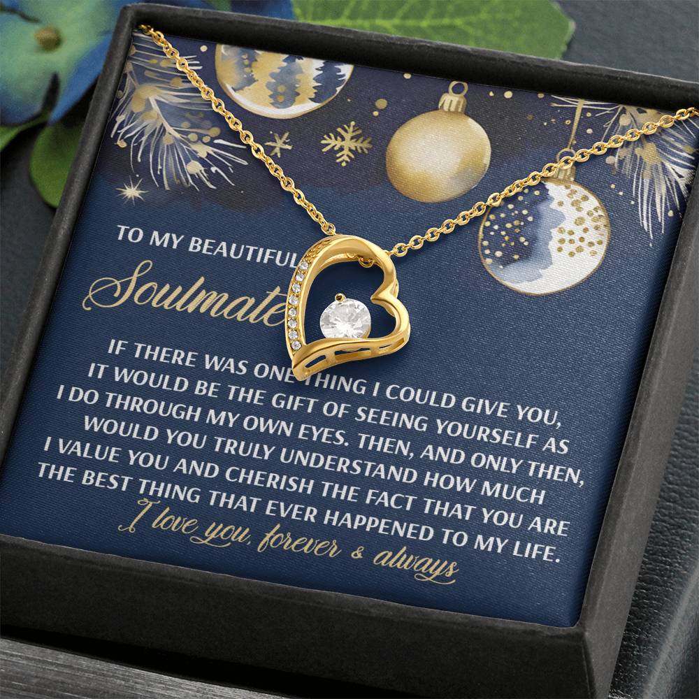 The Soulmate-One Thing - Forever Love Necklace boasts a gold heart adorned with a brilliant CZ crystal, perfectly showcased alongside a touching message about love. This sophisticated accessory is presented in an exquisite black gift box featuring festive ornament artwork and finished in striking white gold.