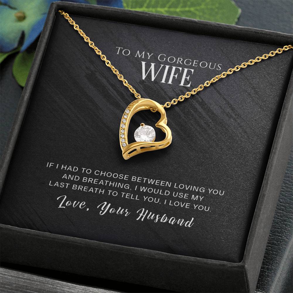 A gold finish, heart-shaped To My Wife, I Love You - Forever Love Necklace pendant inside a gift box with a loving message from a husband to his wife by ShineOn Fulfillment.