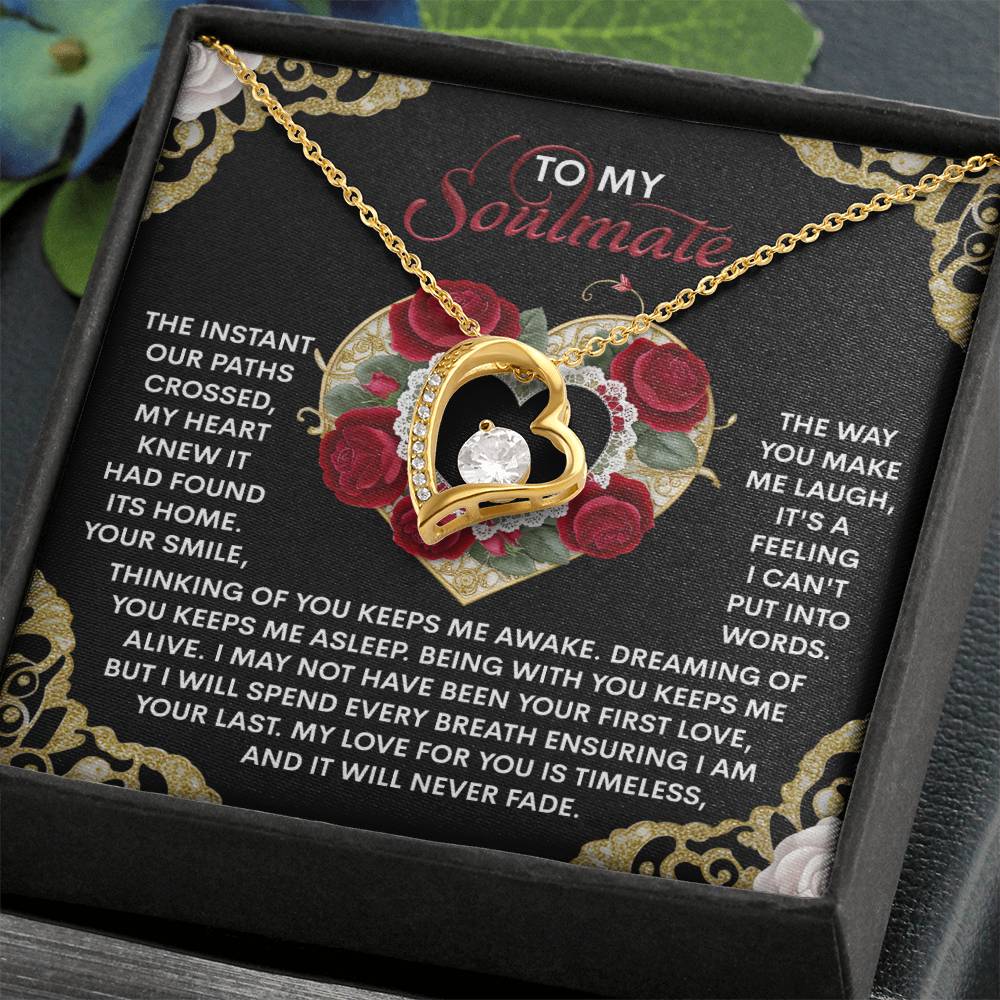 The Soulmate-Never Fade - Forever Love Necklace features a heart-shaped design with a CZ crystal center and comes in a gift box displaying the "To My Soulmate" message with floral details. Available in white or yellow gold finish for an elegant touch.