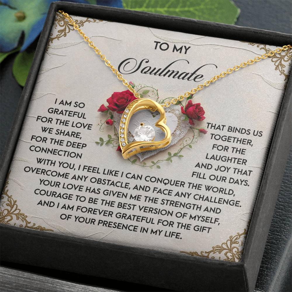 The Soulmate-Our Days Forever Love Necklace showcases a gold heart-shaped pendant with a diamond, elegantly presented in a gift box. Its white gold finish enhances its allure, complemented by a heartfelt message about gratitude and love for a soulmate inside the box.